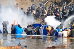 Police sprayed mace and pepper spray intermittently at activists in cantapeta creek - photo by c.s. hagen