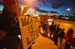 Fargo resident dean hulse holds up a water is life sign during national day of solidarity with standing rock - photo by c.s. hagen