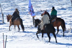 Horse riders in the snow outside Oceti Sakowin - photo by C.S. Hagen
