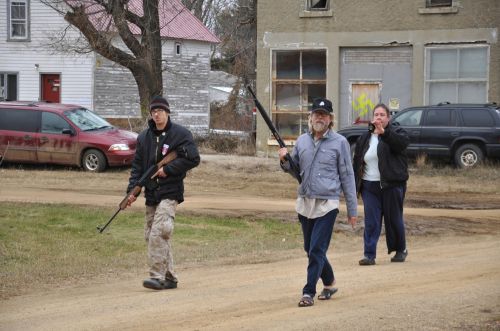 Craig Cobb and Dutton marching through Leith with weapons - photo by Gregory Bruce