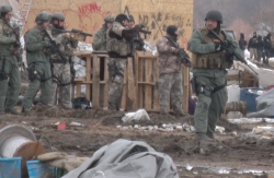 Well armed police prepare to clear an area - photo provided by North Dakota Joint Information Center