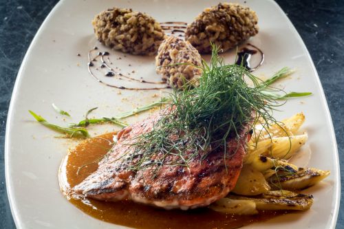 Entrée: Orange sockeye salmon marinated in honey with a burnt orange sauce; caramelized fennel, quinoa, and jasmine rice, fennel pollen and tarragon – Prepared by Executive Chef Ryan Shearer