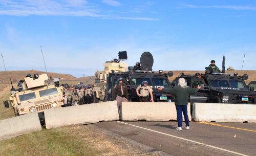 Mike Allard negotiating with law enforcement at Backwater Bridge - photo by C.S. Hagen