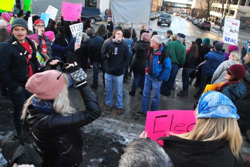 Fargo's Women's March 2018 - encircling white supremacist Pete Teft - photograph by C.S. Hagen