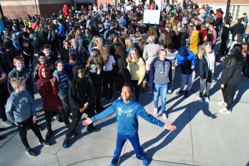 Some students were playful, glad for the 17 minute break, others were more solemn, sitting or standing quietly - photograph by C.S. Hagen