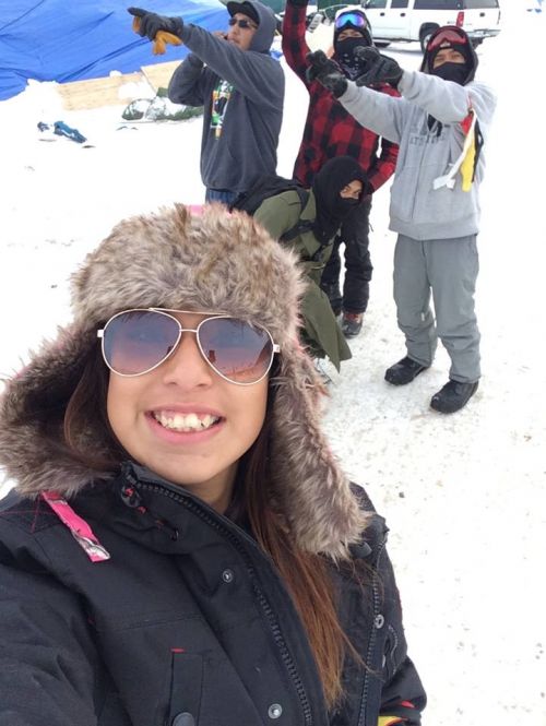 Laycie Williams with fellow security at Oceti Sakowin - photograph provided by Melaine Stoneman