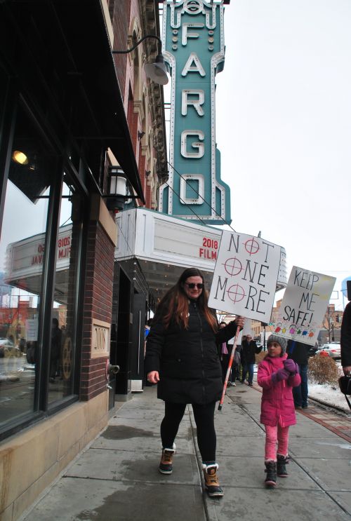 Parents and young children all marched holding signs, anc chanting - which could be heard from six blocks away - photograph by C.S. Hagen