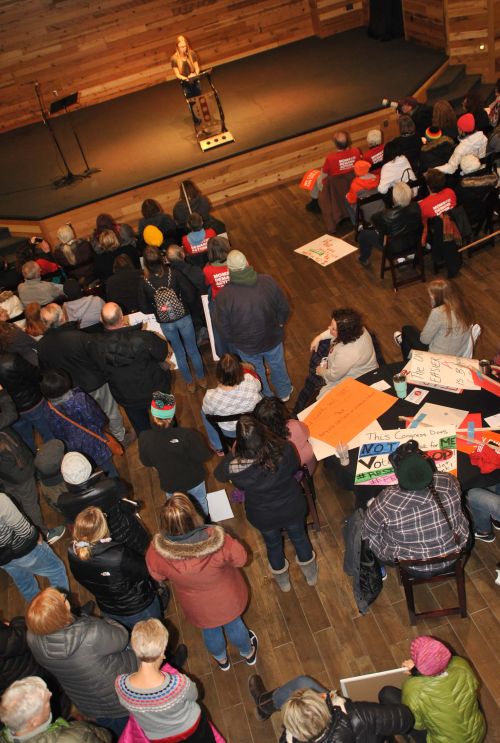 Sheyenne High School student Mauli Sand speaking before hundreds - photograph by C.S. Hagen