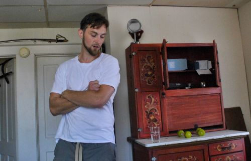 Arms crossed, fists clenched, Nathan Evenson discusses Fargo guitarist Cody Conner's death - photograph by C.S. Hagen