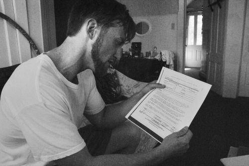 Nathan Evenson studies the elusive Massello Report he never received - photograph by C.S. Hagen