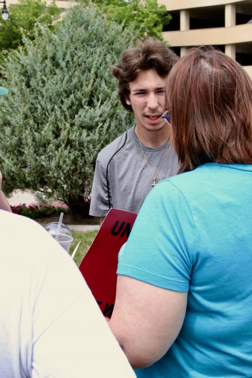 Lone counter protester came to challenge - photograph by C.S. Hagen