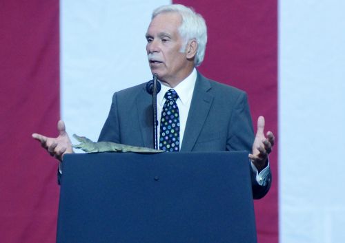 Former Governor Ed Schafer speaking before President Trump's Make America Great Again Rally in Fargo - photograph by C.S. Hagen