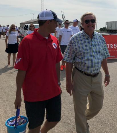 Kelly Armstrong (left) and Jack Dalrymple walking in Parade in Casselton with the District 22 Republicans - Armstrong's Twitter 