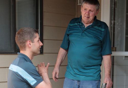 Brandon Medenwald meets Jim Delling, a long-time resident of District 41 - photograph by C.S. Hagen