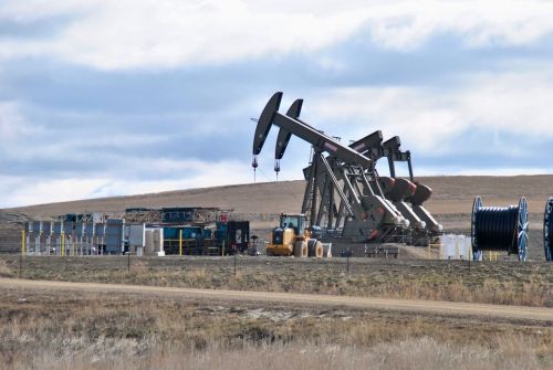 Operational oil wells in the Bakken, nodding donkeys are wells still pumping with little or no profit - photograph by C.S. Hagen