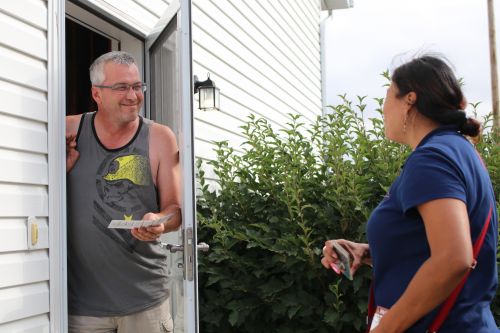 Ruth Buffalo talking to a potential constituent along her route in South Fargo - photograph by C.S. Hagen