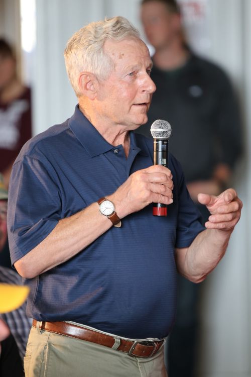 State Senator Jim Dotzenrod who is running for the Agicultural Commissioner's seat asks questions during a speech on farm and trade issues - photograph by C.S. Hagen