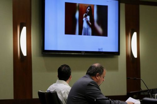William Hoehn looks on as a picture of Savanna Greywind is shown on screens in court - photograph by C.S. Hagen