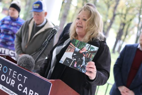 West Fargo resident Jennifer Restemayer speaks about health care issues in Fargo's Island Park - photograph by C.S. Hagen