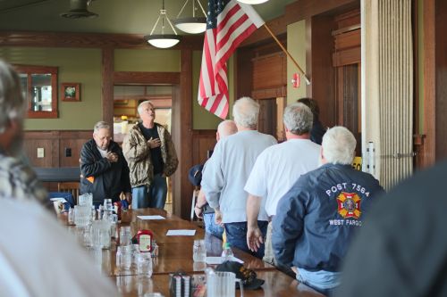 Concerned citizens fighting for their pensions pledge allegiance to the flag that represents the government trying to take away the livelihood - photograph by C.S. Hagen