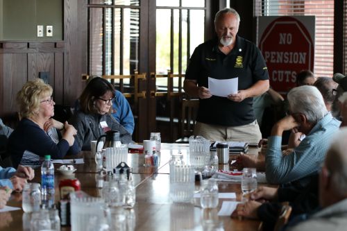 Dennis Kooren, who has been fighting for keeping pensions and changing laws for more than three years, talks before concerned citizens - photograph by C.S. Hagen