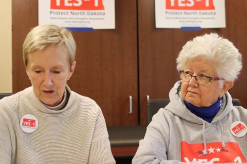 President of North Dakotans for Public Liberty looks on as Ellen Chaffee speaks about her findings related to lobbyist expenditures - photograph by C.S. Hagen