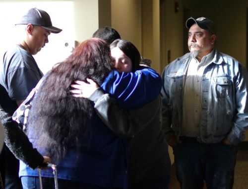 Friends and family of the Greywinds hug after sentencing - photograph by C.S. Hagen