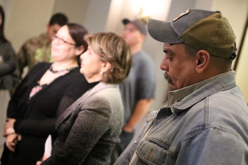 Forefront - Joe Greywind speaking about how grateful the family is for their support during the past 14 months - photograph by C.S. Hagen