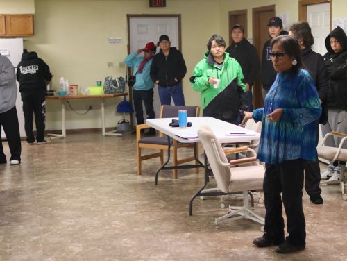 Former Standing Rock Sioux Tribe councilwoman Phyllis Young speaking to people who are door knocking and driving voters to and from the polls - photograph by C.S. Hagen
