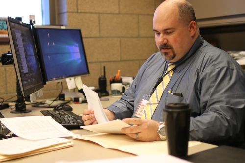 Captain Andrew Frobig at his desk at the Cass County Jail - photograph by C.S. Hagen