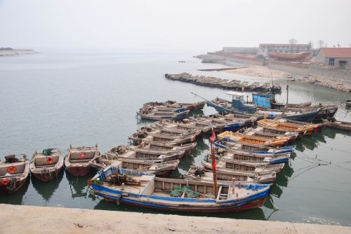 Fishermen boats docked at sea, Shandong, China - photograph by C.S. Hagen