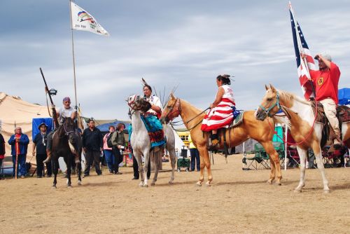 Activist Joanne Spotted Bear and other Natives, one wielding a rifle used during the Battle of the Greasy Grass (Custer’s Last Stand). When asked to give up the weapon, the activist did without question - photograph by C.S. Hagen