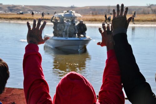 Activists in November 2016 facing law enforcement outside of the main No-DAPL camps - photograph by C.S. Hagen