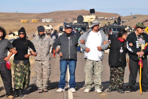 Activists protecting other activists from marching on law enforcement line in November 2016 - photograph by C.S. Hagen