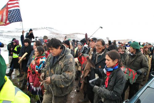 On the final day before law enforcement tore down the main No-DAPL camps, hundreds who survived the harsh North Dakota winter leave - photograph by C.S. Hagen