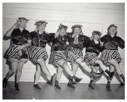 Male performers in women's clothing dancing at the Fargo Elks Lodge