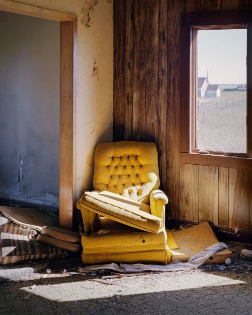 Chair in abandoned house, Arena, North Dakota - photograph by Lew Ableidinger