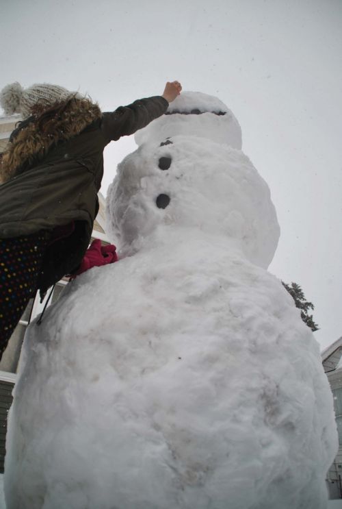 Pinning the nose on Old Man Winter - photograph by C.S. Hagen