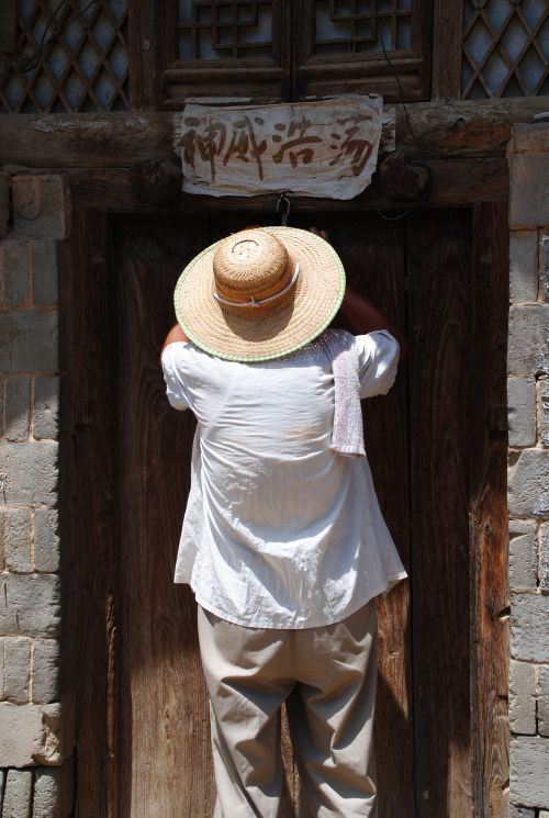 Lei Ying closing up his fathers old clinic - photograph by C.S. Hagen