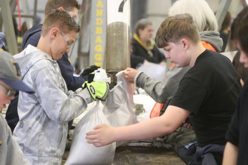 Fargo students sandbagging - photograph by C.S. Hagen