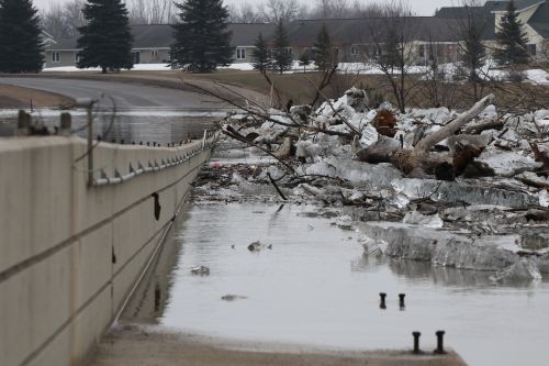 Ice jam against 12th Avenue Bridge crossing into Moorhead, MN - photograph by C.S. Hagen