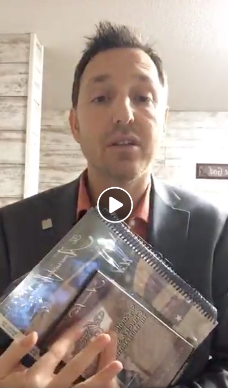 Screenshot of Jake MacAuley after North Dakota speech holding up paraphenalia - Facebook