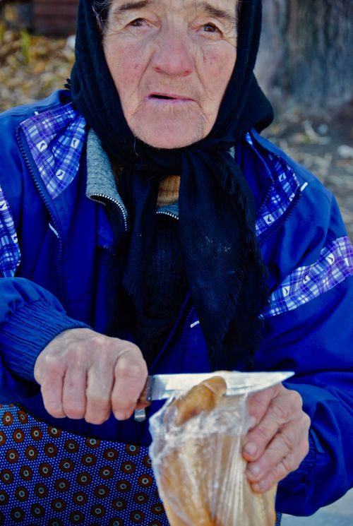 A mother, a grandmother, selling cheese in Transylvania, Romania - photograph by C.S. Hagen