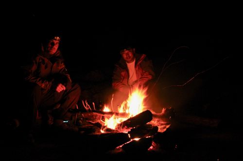 Sitting around the fire while camping in Xinjiang, China - photograph by C.S. Hagen