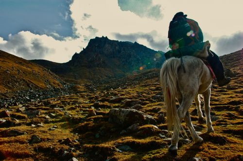 Hiking - on horses - in Xinjiang, China - photograph by C.S. Hagen