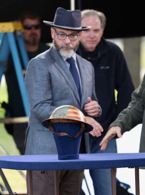 After shaking hands with the owner, appraiser Jeffrey Shrader transfixed on the Holy Grail of World War I helmets - photograph by C.S. Hagen