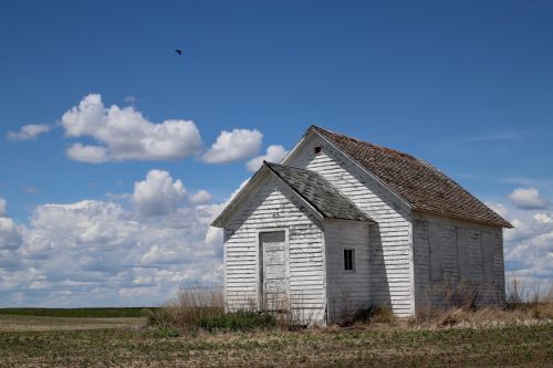 An abandoned building outside of Tuttle - photograph by C.S. Hagen