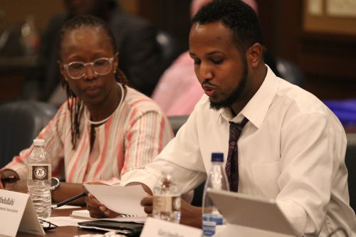 Hukun Abdullahi and Laetitia Mizero Hellerud - Advocate and Social Justice Activist - offering testimony - photograph by C.S. Hagen