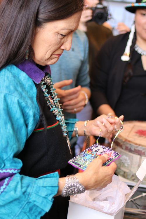 Congresswoman Debra Haaland comes close to tears after receiving handmade gifts - photograph by C.S. Hagen