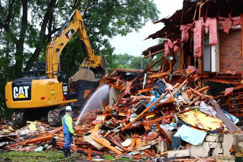 Houses being torn down for th eNewman Center project - photograph by C.S. Hagen